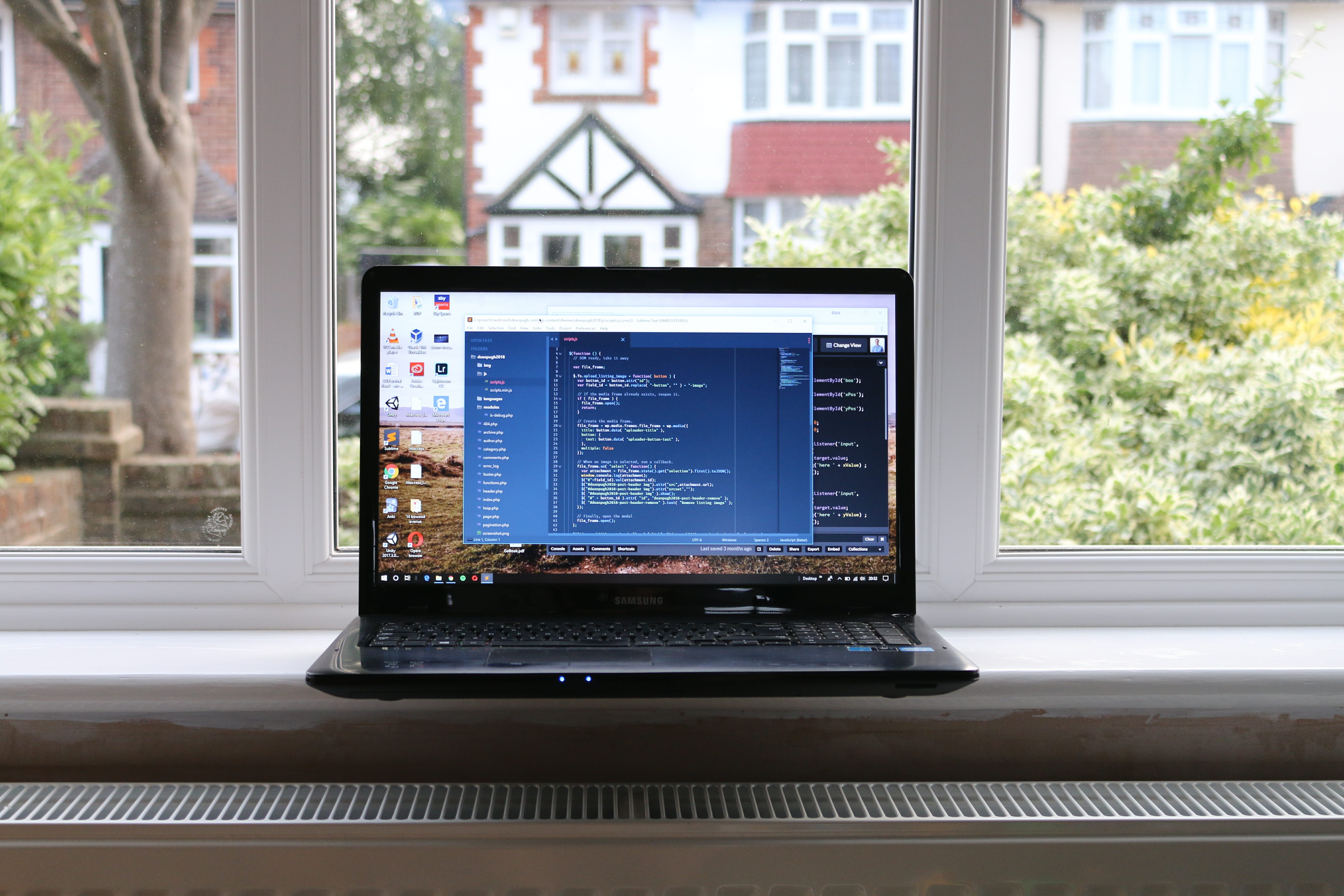 Laptop on a window ledge